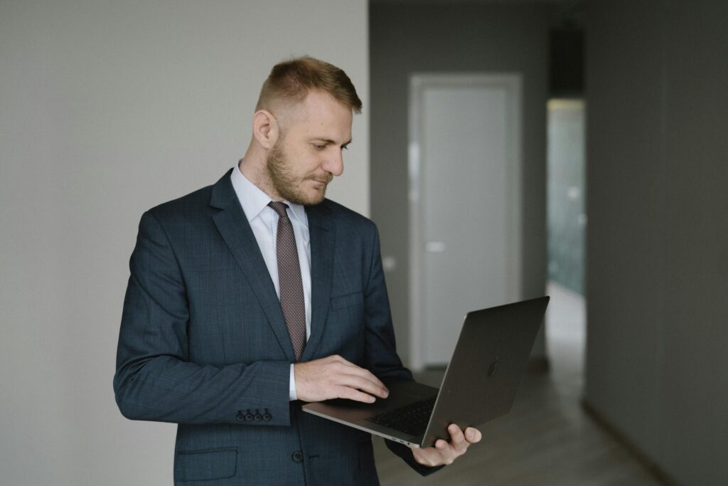 a man using a laptop inside a house